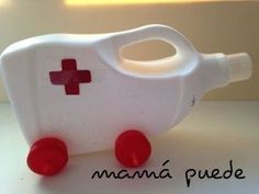 a white plastic container with a red cross on the front and sides, sitting on top of a table