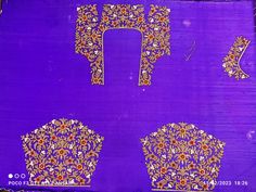 an intricately designed purple cloth with gold and red designs on the front, back and sides