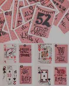 a bunch of playing cards with some writing on them, all in different shapes and sizes