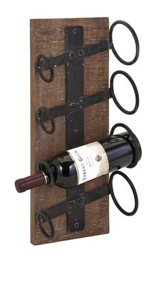 a bottle of wine and two pairs of scissors on a wooden wall mounted wine rack