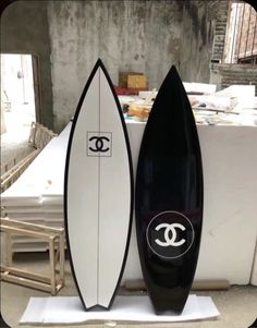 two surfboards sitting next to each other on display