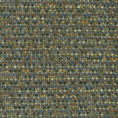 an upholstered, multicolored tweed fabric with small squares and dots on it