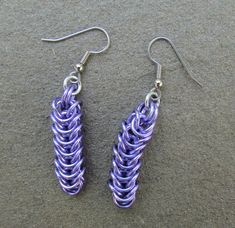 Chain maille earrings are a petite and delicate way of demonstrating the beauty and intricacy of the box chain weave, a common and popular weave in chain maille. These lovely jump ring earrings are sure to bring you lots of compliments!  These purple earrings are crafted from anodized aluminum jump rings in a pretty shade of lavender purple. The earring hooks are made of surgical steel. They are very lightweight and comfortable. Each earring measures approximately 3/8 inch wide and 1 5/8 inches Metal Link Earrings For Gifts, Metal Earrings With Box Chain For Gift, Jump Ring Earrings, Jump Ring Jewelry, Chain Maille Jewelry, Chain Maille, Earrings Purple, Purple Earrings, Lavender Purple