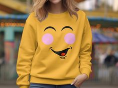 Express with Emoji: Yellow Shirt Collection 😀 Elevate your wardrobe with our emoji-inspired yellow shirts, adding a dash of fun and expression to your style. Why Choose Our Emoji Yellow Shirts? ✨ Support a Small Business: Your purchase directly supports our creative journey, helping us bring more cheerful designs to life. 😃 Express Yourself: Wear the iconic emoji face proudly and let your emotions shine through your fashion. 🌟 Premium Quality: Crafted with care, our shirts offer comfort and vibrant style, perfect for a pop of color. 🎁 Perfect Gift: Share the joy of expression with a friend, and gift them a shirt that's as bright as their smile. Join us in celebrating the art of expression. Shop now and add a touch of cheerfulness to your attire! 𝐏𝐑𝐎𝐂𝐄𝐒𝐒𝐈𝐍𝐆 𝐓𝐈𝐌𝐄 𝗔𝗡𝗗 𝐒? Happy Emoji Smiley, Iconic Emoji, Smiley Face Sweatshirt, Happy Emoji, Emoji Face, Vibrant Style, Emoji Faces, Yellow Shirt, Yellow Sweatshirt