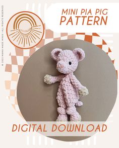 a crocheted pink teddy bear sitting on top of a white and brown background