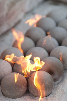 the fire is burning in some balls on the ground