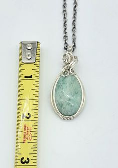 Nice amazonite cabochon-- see all pics especially close ups. Stone has a few areas of rough finish that flash with chatoyancy! Video found on my instagram @leetwraps This is made from .925 sterling silver. Ready to wear! Comes on an 18 inch stainless steel chain as seen in the photos... also comes in a gift box and with a polishing cloth. Wire Jewelry Designs, Steel Chain, Sterling Silver Necklace, Stainless Steel Chain, Jewelry Designs, Wire Jewelry, Sterling Silver Necklaces, Wire Wrapped, Wire Wrapping