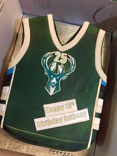 a birthday cake made to look like a basketball jersey