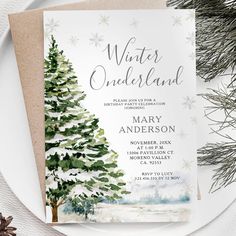 the winter wonderland party card is shown on top of a plate with pine trees and snowflakes