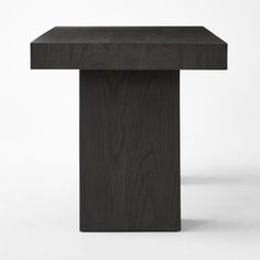 a wooden table with a black top on a white background