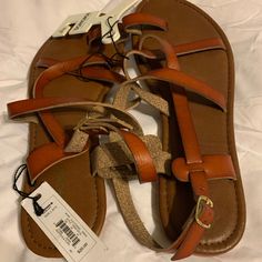 Sonoma Sandals, Tan, Size 9/10, Brand New Brown T-strap Sandals With Adjustable Strap For Vacation, Casual T-strap Sandals With Round Toe And Adjustable Strap, Casual T-strap Sandals With Adjustable Round Toe, Vacation T-strap Sandals With Adjustable Strap, Summer Vacation T-strap Footbed Sandals, Casual T-strap Sandals With Buckle For Vacation, Casual T-strap Sandals With Buckle Closure For Vacation, Casual Brown Sandals With Adjustable Strap, Casual T-strap Sandals With Adjustable Strap For Vacation