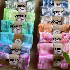 several different colored tie dyes are stacked on top of each other and labeled with words