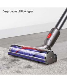 a close up of a vacuum cleaner on the floor with text that reads deep clean all floor types