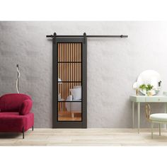 a living room with a red chair and a sliding glass door that opens to the outside