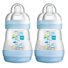 two baby bottles sitting next to each other