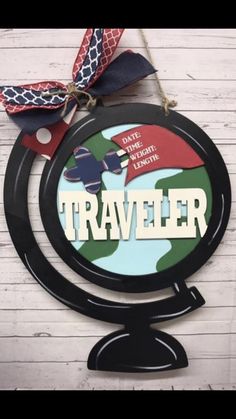 a sign that says traveler on it with a red, white and blue ribbon around it