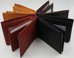 Genuine Premium Cowhide Leather Bifold Double Center Flap 3 ID Windows and 12 + Credit Card Slots Wallet Genuine Cowhide Leather Dimensions (LxW): 4 1/4 in x 3 1/4 in 9 Credit card slots with 3 additional side slots / 3 ID windows Divided bill compartment Brown, Tan, Burgundy Available Upon Request Id Wallet, Card Storage, Money Clip Wallet, Gifts For Husband, Wallet Men, Purse Wallet, Cowhide Leather, Card Slots, Valentine Gifts