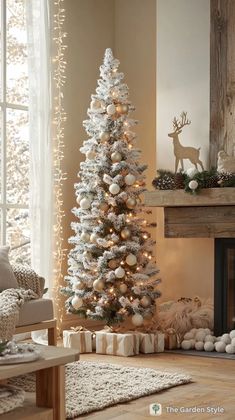 a white christmas tree in front of a fireplace with presents on the mantle and garlands around it