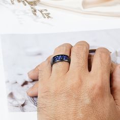 Some rings keep it simple—this one shoots for the stars. The Cory Orion Nebula Band features an opal and sandstone inlay that feels like you’re wearing a slice of the galaxy. Deep blues, shimmering flecks, and cosmic swirls give it a vibe that’s more “nebula” than “normal.” Wrapped in tough black tungsten carbide, this ring doesn’t just look good—it’s built to last, like the promises it represents. For the guy who’s always reaching for something extraordinary! DETAILS Handcrafted with an opal an Space Ring, Alexandrite Necklace, Pave Heart Necklace, Rutilated Quartz Necklace, Space Rings, Black Gold Ring, Mens Wedding Bands Tungsten, Orion Nebula, Blue Sandstone