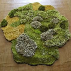 the rug is made up of different types of moss