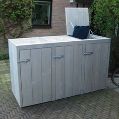 an outdoor storage area with a bicycle parked next to it