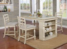 a dining room table and chairs in front of a window