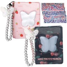 three different types of key chains and wallets with butterflies on the front, one in pink