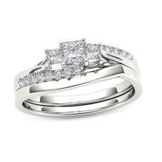 a wedding ring set with two princess cut diamonds