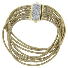 Here we have a beautiful multi strand gold bracelet crafted in solid 14k yellow gold. It feature very fine and well done coiled gold wire that wraps around each strand and offers soft silky feel around the wrist. The clasp is fully encrusted with approximately 3/4 carats of round cut diamonds, adding a wonderful touch of brilliance to this statement piece. A truly outstanding bracelet that remains in excellent condition and is ready to wear and impress. Enjoy :) --Stone(s):-- (77) Natural Genuin Gold Armband, Bracelet Crafts, Well Done, Gold Wire, Multi Strand, Round Cut Diamond, Link Bracelets, Chain Bracelet, Round Cut