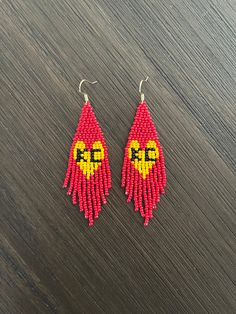 Show your support for the Kansas City Chiefs by wearing this KC earring!   Details: * Handmade * Lightweight * Toho Seed Beads * Nylon Thread * Nickel Free Ear Hook * Length - 3.07 in * Width - 1.10 in Red Heart Beads Jewelry For Crafting, Red Tiny Beads For Crafting, Red Beads For Crafting, Diy Seed Bead Earrings, Fringe Earring, Kansas City Football, Boho Earring, Toho Beads, Beaded Fringe