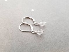 "These swarovski crystal earrings are a perfectly simple, and are great for every day wear! A genuine swarovski crystal hangs from each earwire. The crystals are 6mm. The total length of these earrings is aprox 3/4\". These earrings are a perfect match to the necklace found here: https://www.etsy.com/listing/75468258/tiny-clear-swarovski-crystal-and?ref=shop_home_active_21 Also available in Gold filled and Rose Gold filled! These earrings will arrive in a small zip lock bag, as well as a decorat Hypoallergenic Sterling Silver Crystal Earrings For Everyday, Everyday Hypoallergenic Sterling Silver Crystal Earrings, Silver Crystal Earrings With Ear Wire For Everyday, Dainty Sterling Silver Crystal Earrings For Everyday, Minimalist Hypoallergenic Sterling Silver Crystal Earrings, Nickel-free Sterling Silver Crystal Earrings For Everyday, Nickel Free Sterling Silver Clear Crystal Earrings, Sterling Silver Crystal Earrings With Lever Back, Nickel-free Sterling Silver Clear Crystal Earrings