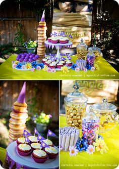 an assortment of desserts and sweets displayed on a table in the garden, including cupcakes