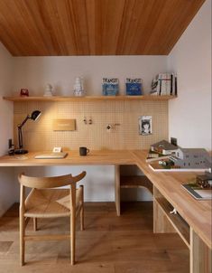 a wooden desk and chair in a room