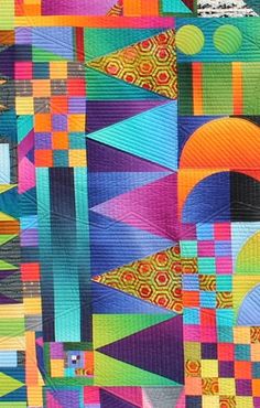 an abstract quilt with many different colors and shapes