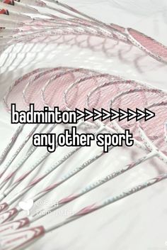 badminton rackets with the words badminton on it and an arrow pointing to each other