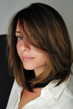 Woman with a long bob featuring side bangs and layers, showcasing a fresh and modern hairstyle. Side Bangs And Layers, Long Bob With Side Bangs, Bob With Side Bangs, Women With Round Faces, Bangs And Layers, A Line Bob