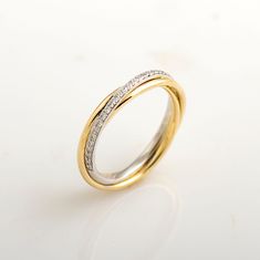 Two-tone, three bands ring made in 14k or 18k yellow & white gold and set with clear diamonds. The ring is made from 3 bands. The bands are soldered and they do not roll so the white gold diamond band (half eternity style) is always on top. There is also an option to make this ring a rolling ring so the bands are loose. This listing is for YELLOW & WHITE GOLD. you can order other colors from the following links: ● Rose & white - https://www.etsy.com/il-en/listing/712768862/ ● Three-tone - https: Mixing White Gold Engagement Ring With Yellow Gold Wedding Band, White Gold Engagement Ring Yellow Gold Wedding Band, 2 Tone Wedding Band, Two Tone Wedding Bands His And Hers, Yellow And White Gold Wedding Band, Yellow And White Gold Ring, White Gold And Yellow Gold Wedding Set, White And Yellow Gold Wedding Band, White And Yellow Gold Wedding Set