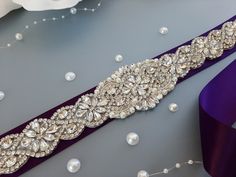 "Plum Purple Bridal Belt, Wedding Dress Belt, Rhinestone Belt, Belt for Bride, Sash Belt, Bridal Belts And Sashes, Bridesmaid Belt Made with love in our studio in California <3 This gorgeous wedding belt will be an amazing complement  for your dress! The ribbon is double side faced silky satin or organza ribbon of high textile quality. It is pleasant to eye and soft to touch. The color is wholesome and saturated. The jewel part includes rhinestones, crystals, pearls of different sizes. The combi Bridal Belts And Sashes, Bride Sash, Belt Ribbon, Belt Wedding Dress, Bridesmaid Belt, Bridal Belts, Purple Wedding Dress, Purple Belt, Wedding Belt