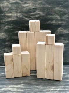 several wooden blocks stacked on top of each other