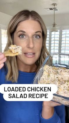 a woman holding up a chicken salad in front of her face with the words loaded chicken salad recipe