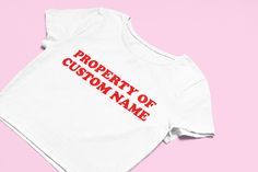 Property Of Custom Name Crop Top | Flowy Fit Crop Top | Choose Any Name | Graphic Top | Gift For Her | Gift For Girlfriend | Custom Crop Top ** Shirt is a Flowy Fit, Snug Fit Crop Top Available In Our Shop ** Comfy Top to Lounge in! Actual item may be lighter/darker than pictured. M A T E R I A L S - 100% RING SPUN COTTON - Flowy Fit - Shoulder Taping S I Z I N G - Size chart is available on our listing photos. S H I P P I N G  &  P R O D U C T I O N  T I M E - Mockups will be delivered within 2 Funny Crop Tops, Custom Crop Top, Flowy Crop Top, Stylish Crop Top, Trendy Crop Tops, Graphic Crop Top, Girls Crop Tops, Y2k Clothing, Trendy Top