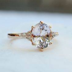 an engagement ring with two pear shaped diamonds