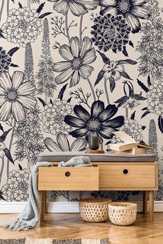 the wallpaper in this room is painted with black and white flowers