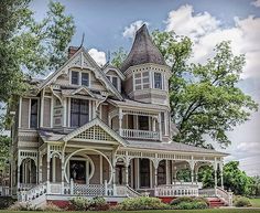 an old victorian style house in the country