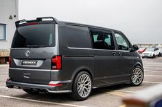 a grey van parked in a parking lot