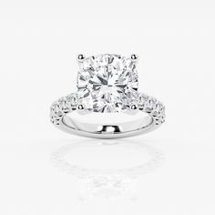 a diamond engagement ring on a white background