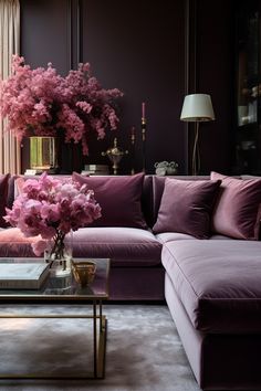 a living room filled with purple furniture and flowers