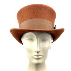 Brown top hat. You can make the hat with your favorite color by choosing it from my Wool felt color card. In the ad, this is the chocolate color Made with chocolate brown wool felt short crown and embellished with a grosgrain ribbon. Edwardian top hat ideal for everyday and special ocasions such as weddings, cocktails or parties. For man and woman. Measurements in centimeters are 32 x 27. Crown height 11. Brim length 6. These measurements may have some slight variation depending on the size of t Fitted Brown Brimmed Top Hat, Victorian Top Hat With Short Brim For Formal Occasions, Elegant Brown Felt Hat, Vintage Fur Felt Cloche Hat For Winter, Classic Brown Hat For Kentucky Derby, Fitted Brown Boater Hat For Kentucky Derby, Fitted Brown Top Hat With Short Brim, Classic Short Brim Costume Hat For Winter, Classic Short Brim Winter Costume Hat