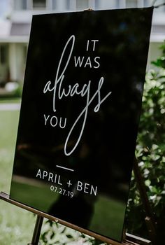 a sign that says it was always you and is in front of a house with trees