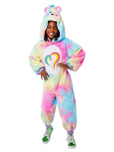 Your child will be spreading love, magic, and all the colors of the rainbow this year when you pick up our Kids Comfywear Carebears Togetherness Bear Costume. With this set, you will receive everything your tyke needs to bring everyone together through the power of love and care. Featuring a cozy multi-colored onesie with a rainbow heart on the front, as well as a Carebear face hood, your child is going to love this special attire. Care Bear Costume, Care Bears Halloween, Care Bears Halloween Costume, Best Group Costumes, Halloween Outfit Ideas, Bear Halloween, Pajama Day, Comfy Jumpsuits, Halloween Costume Kids